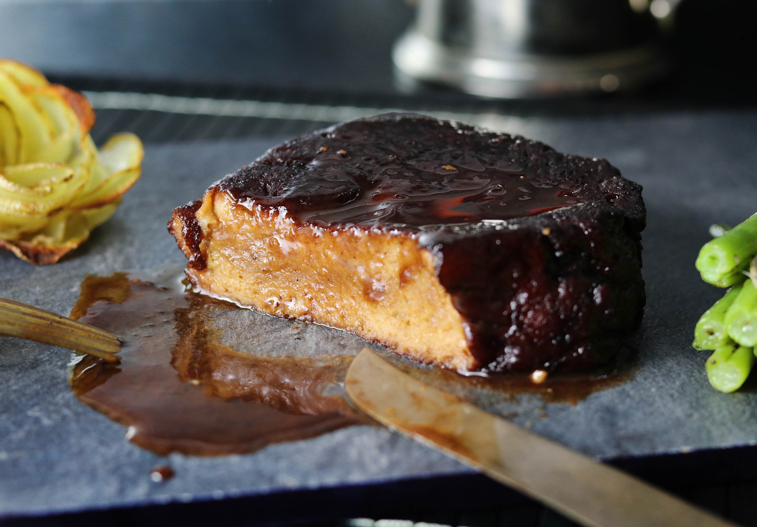 Seitan steaks in red wine glaze with potato roses and green beans