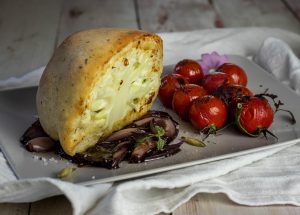 With fresh herbs in the yeast dough