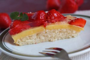 Fresh strawberreis on custard and sponge cake