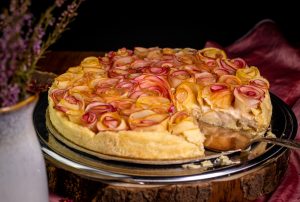 Roses made from apples on a creamy marzipan and custard filling