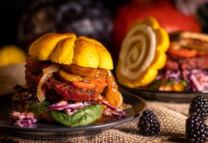 My vegan autumn burger comes in a soft pumpkin bun