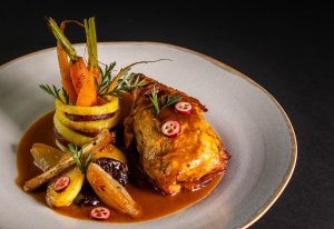 Roasted vegetables and baked fruits as a side dish