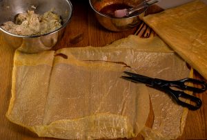 Cutting the yuba for the skin of the vegan goose legs