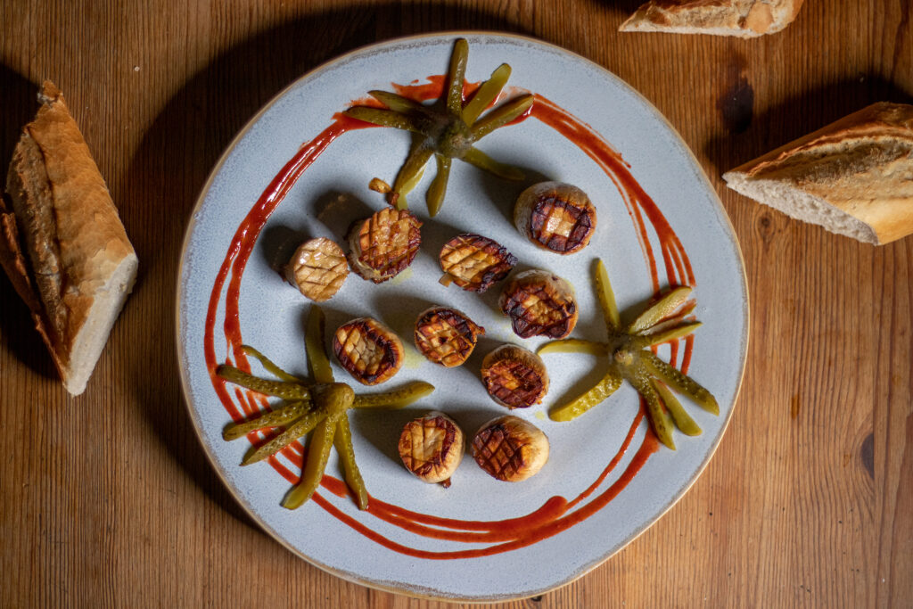 Vegan scallops, here with funny pickled cucumber squids