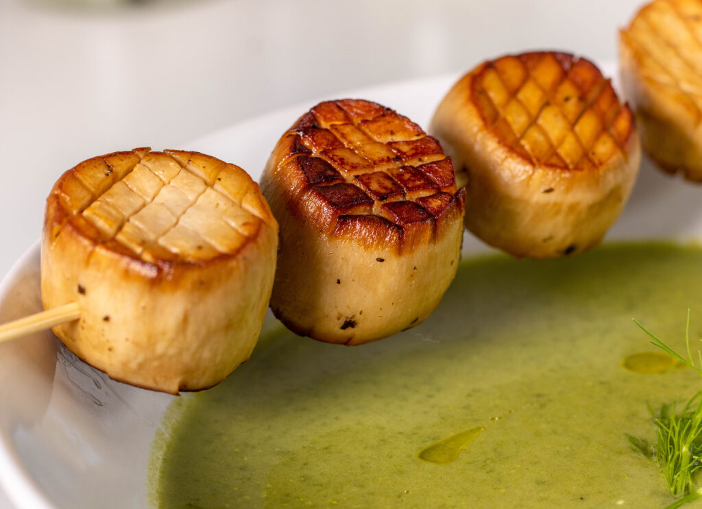 Vegan scallops as a soup garnish for wild garlic and fennel soup.