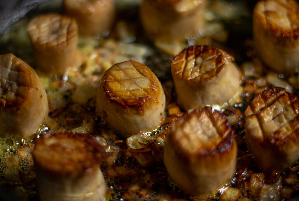 Vegan scallops with garlic and onion in a pan